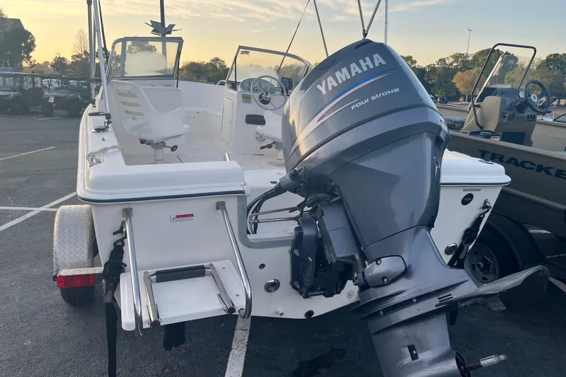 Slide: The Image of 2006 Sea Hunt Escape 175 boat with Yamaha four-stroke engine in parking lot. - 4