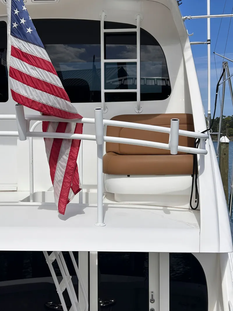 Slide: The Image of Viking ENC FB 2014 yacht with American flag and seating area. - 7