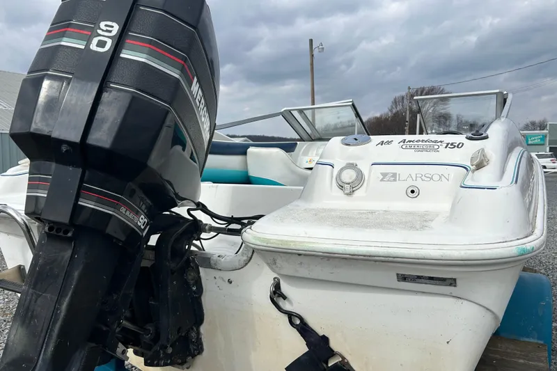 Slide: The Image of 1993 Larson All American 160 boat with Mercury 90 outboard motor. - 11
