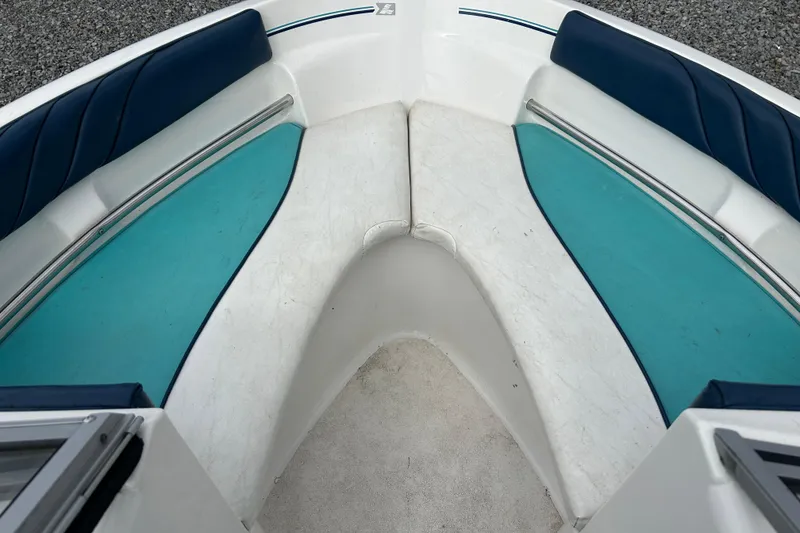 Slide: The Image of Interior of 1993 Larson All American 160 boat with blue and teal seating. - 5