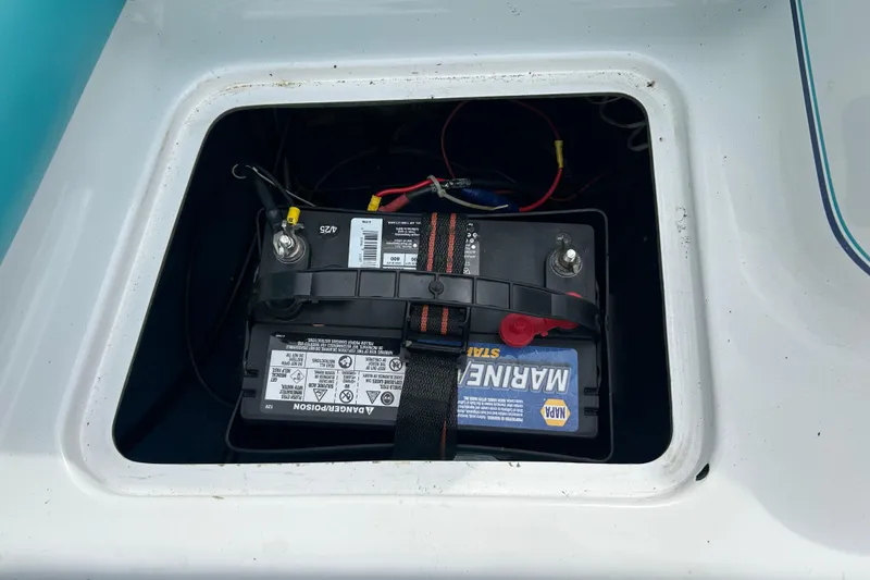 Slide: The Image of Battery compartment of 1993 Larson All American 160 boat with marine battery. - 7