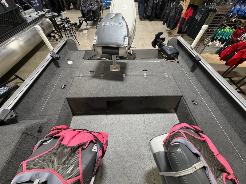 Slide: The Image of Interior view of a 2012 Lund 1775 Impact boat in showroom. - 11
