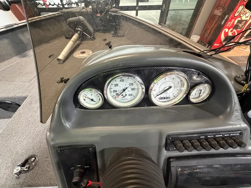 Slide: The Image of Dashboard of a 2012 Lund 1775 Impact boat with gauges. - 13