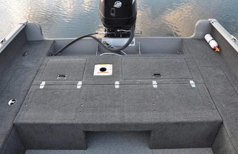 Slide: The Image of 2012 Lund 1775 Impact boat in a showroom. - 7