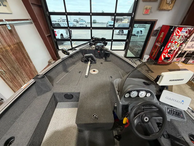 Slide: The Image of Interior view of a 2012 Lund 1775 Impact boat with Garmin and Humminbird equipment. - 9