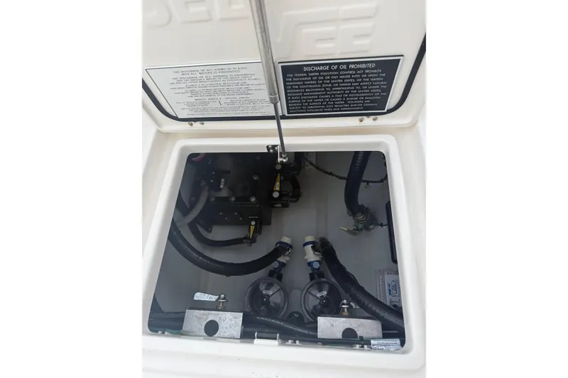 Slide: The Image of 2024 SeaVee 290B boat compartment with visible hoses and mechanical components. - 11