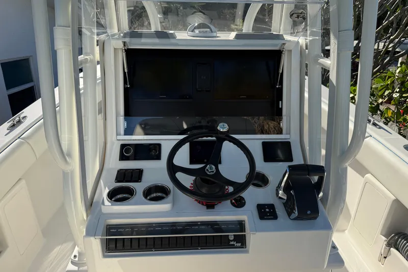 Slide: The Image of 2024 SeaVee 290B boat console with steering wheel and controls. - 5