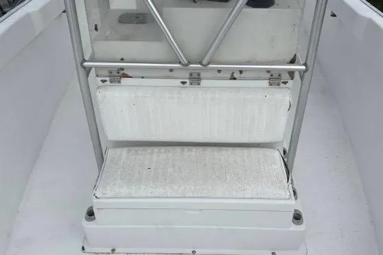 Slide: The Image of 1995 Cape Horn 21 boat seating area with white cushions and metal frame. - 12