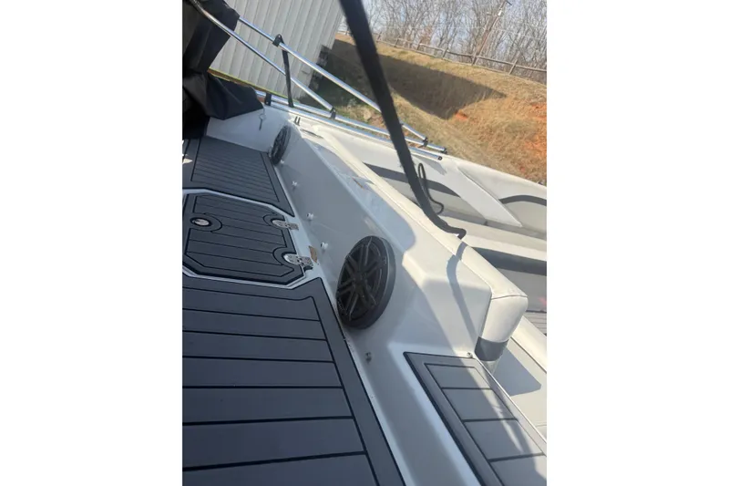 Slide: The Image of 2025 Starcraft SVX 211 OB boat deck with speakers and sleek design. - 5