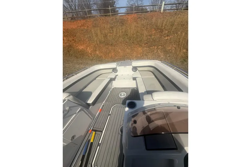 Slide: The Image of 2025 Starcraft SVX 211 OB boat interior with seating and deck view. - 9