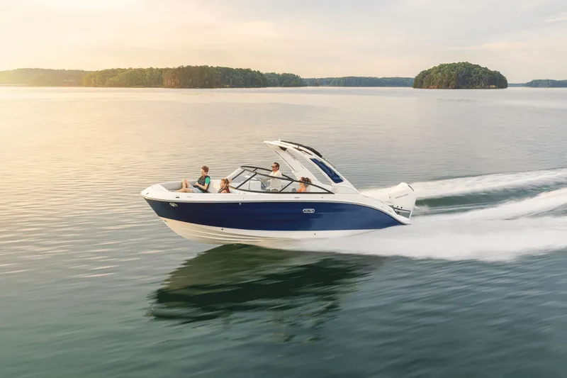 Slide: The Image of 2026 Sea Ray SDX 250 Outboard on trailer in front of MarineMax building. - 0