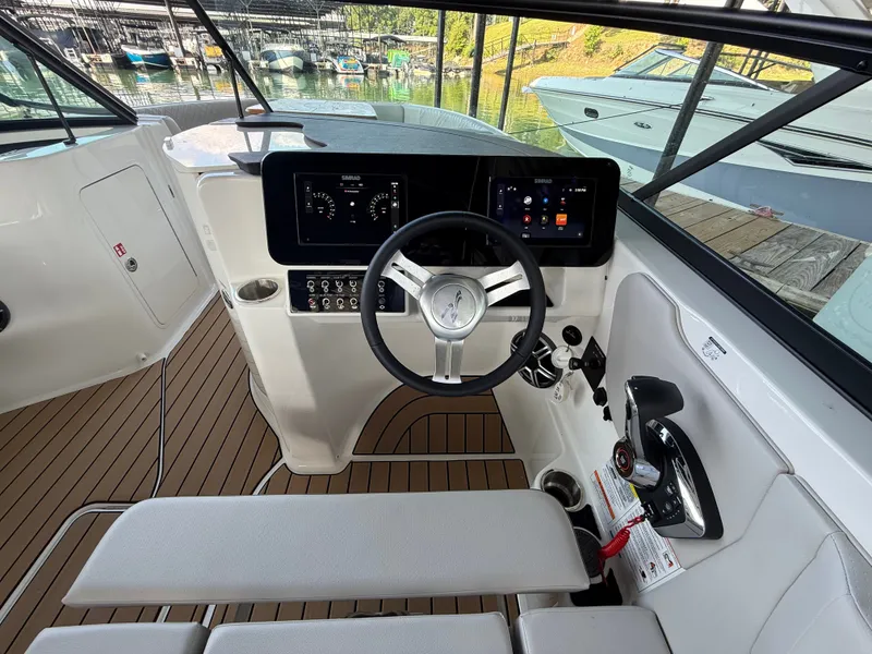 Slide: The Image of The image shows the cockpit of a 2026 Sea Ray SDX 250 boat with modern instruments. - 8