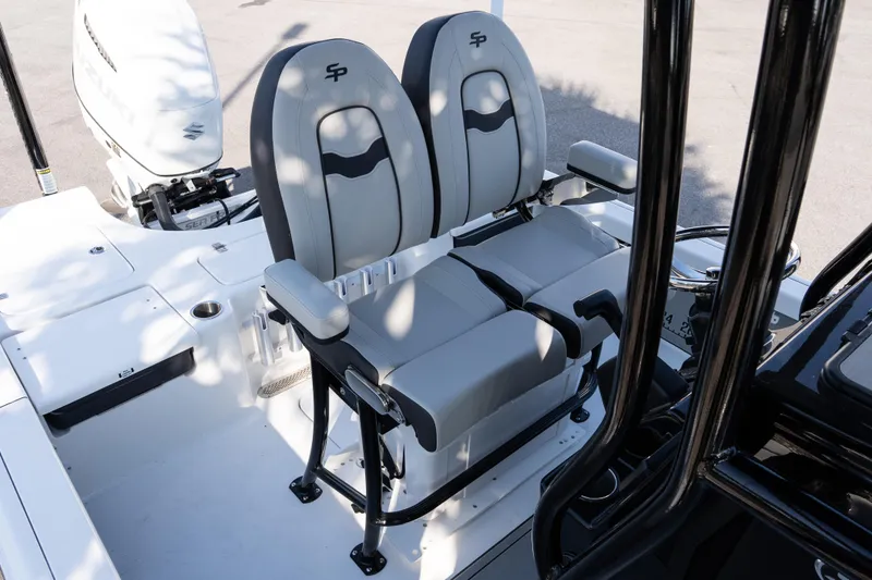 Slide: The Image of 2026 Sea Pro 230 Bay boat with dual seats and Suzuki outboard motor. - 14