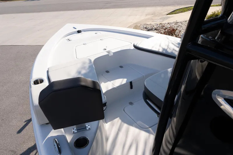 Slide: The Image of 2026 Sea Pro 230 Bay boat interior with seating and storage compartments. - 17