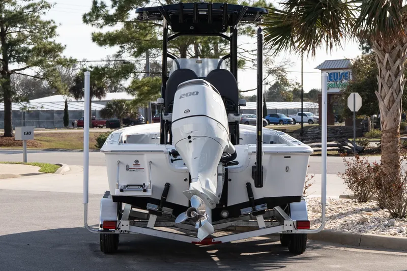 Slide: The Image of 2026 Sea Pro 230 Bay boat on trailer, rear view, parked outdoors. - 5