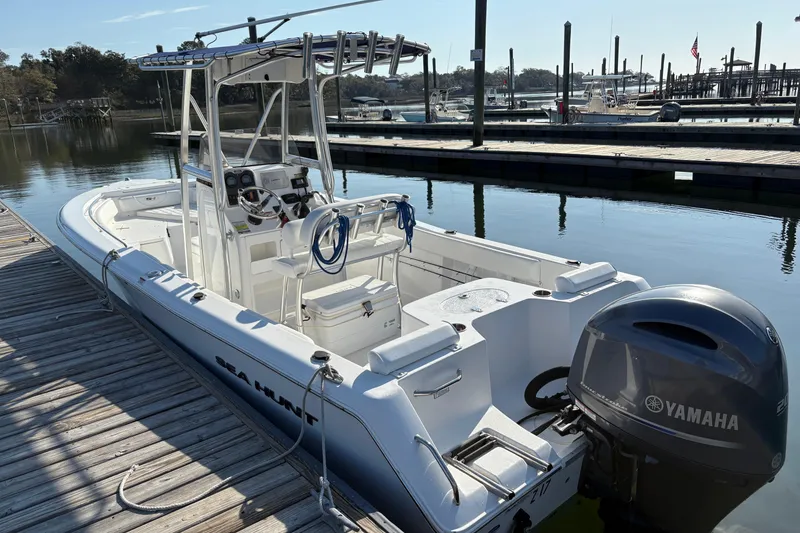 Slide: The Image of 2014 Sea Hunt Triton 225 boat docked with Yamaha outboard motor. - 6