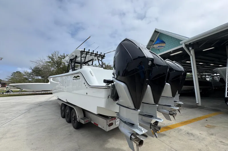 Slide: The Image of 2026 Invincible 36 Catamaran with triple outboard engines on a trailer. - 15