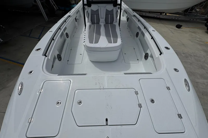Slide: The Image of 2026 Invincible 36 Catamaran deck with seating and storage compartments. - 20