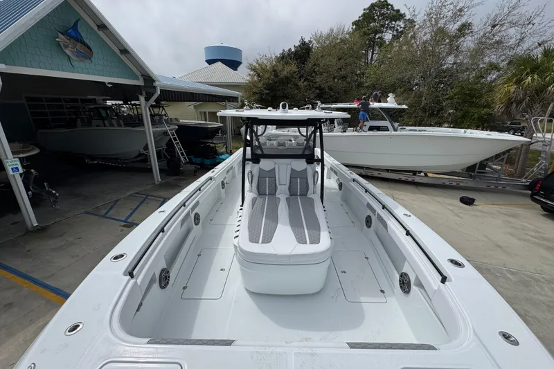 Slide: The Image of 2026 Invincible 36 Catamaran docked, showcasing spacious deck and modern design. - 21