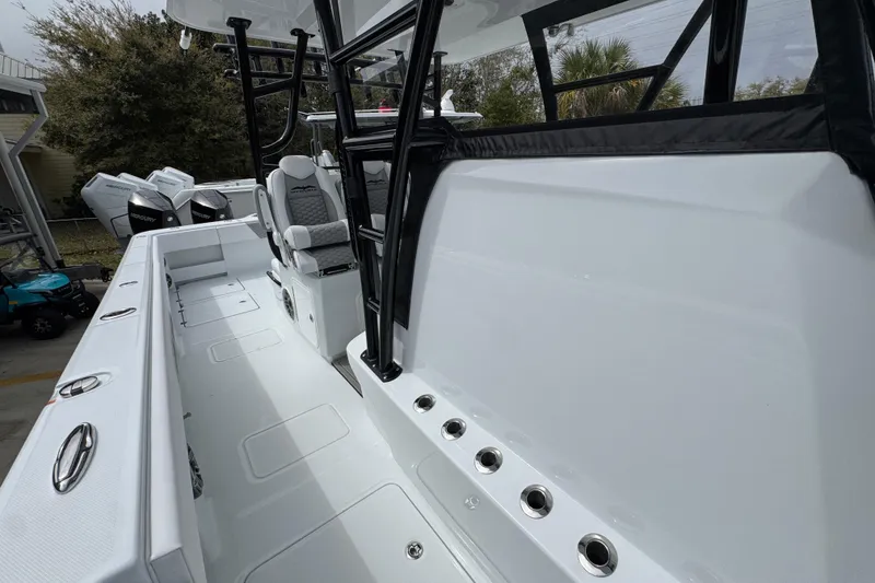 Slide: The Image of 2026 Invincible 36 Catamaran interior with seating and Mercury engines in the background. - 24