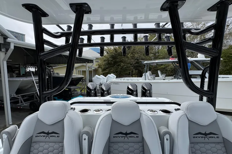 Slide: The Image of 2026 Invincible 36 Catamaran interior with seating and rod holders, showcasing luxury and functionality. - 29