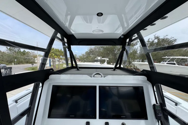 Slide: The Image of 2026 Invincible 36 Catamaran cockpit with dual screens and modern navigation equipment. - 33