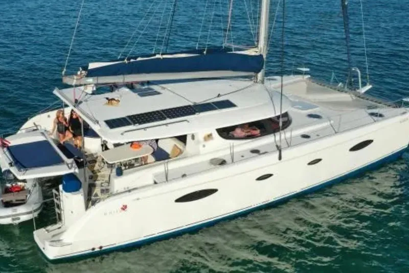 The Image of 2008 Fountaine Pajot Salina 48 Evolution catamaran sailing on clear blue water. - 1