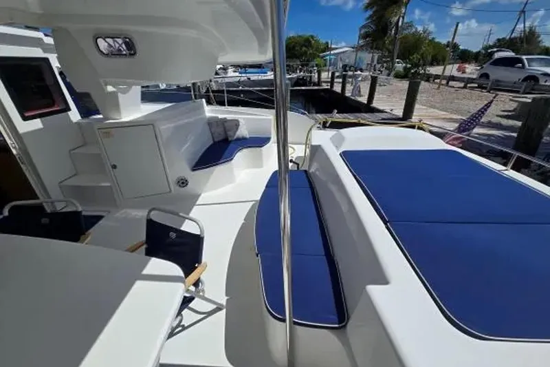 Slide: The Image of Spacious deck of 2008 Fountaine Pajot Salina 48 Evolution catamaran with blue seating. - 14
