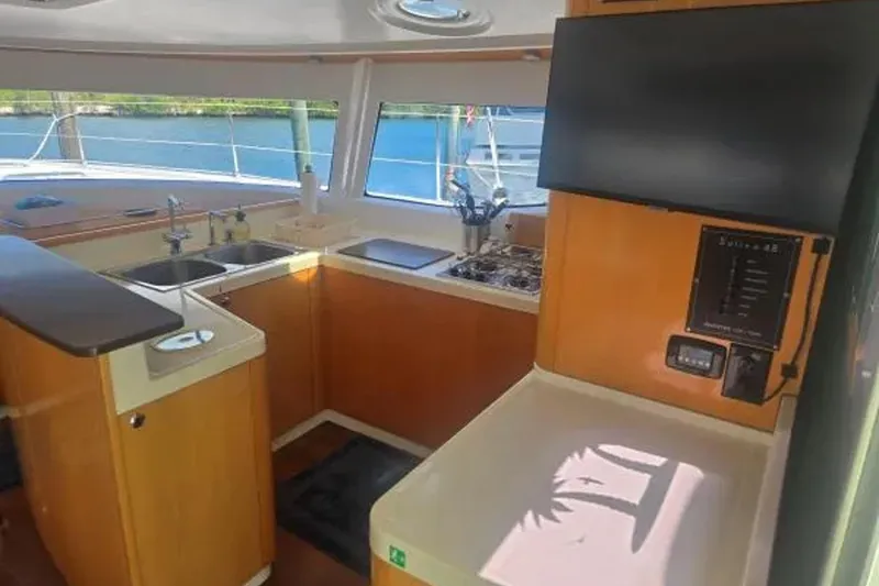 Slide: The Image of Interior of 2008 Fountaine Pajot Salina 48 Evolution yacht kitchen with modern amenities. - 21
