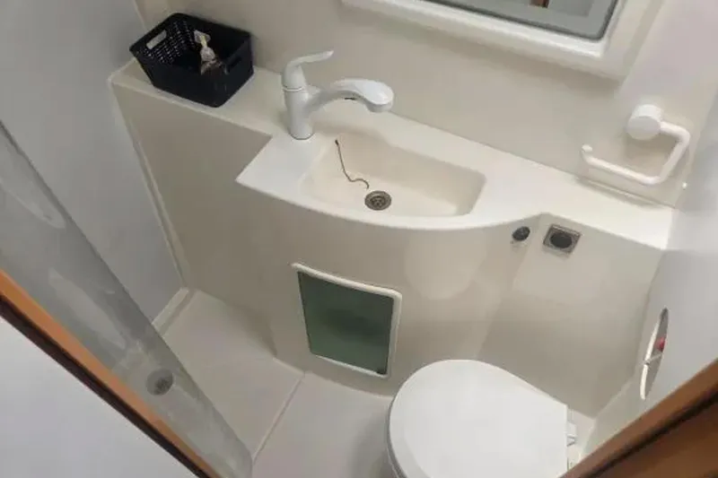 Slide: The Image of Bathroom interior of 2008 Fountaine Pajot Salina 48 Evolution catamaran, featuring sink and toilet. - 26