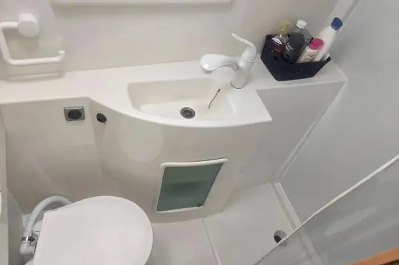 Slide: The Image of Bathroom interior of 2008 Fountaine Pajot Salina 48 Evolution yacht, featuring sink and toiletries. - 29