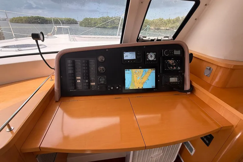 Slide: The Image of Navigation station of 2008 Fountaine Pajot Salina 48 Evolution catamaran with control panels and map display. - 30