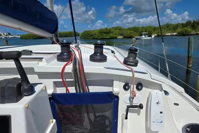 Slide: The Image of 2008 Fountaine Pajot Salina 48 Evolution sailboat deck with winches and ropes. - 9