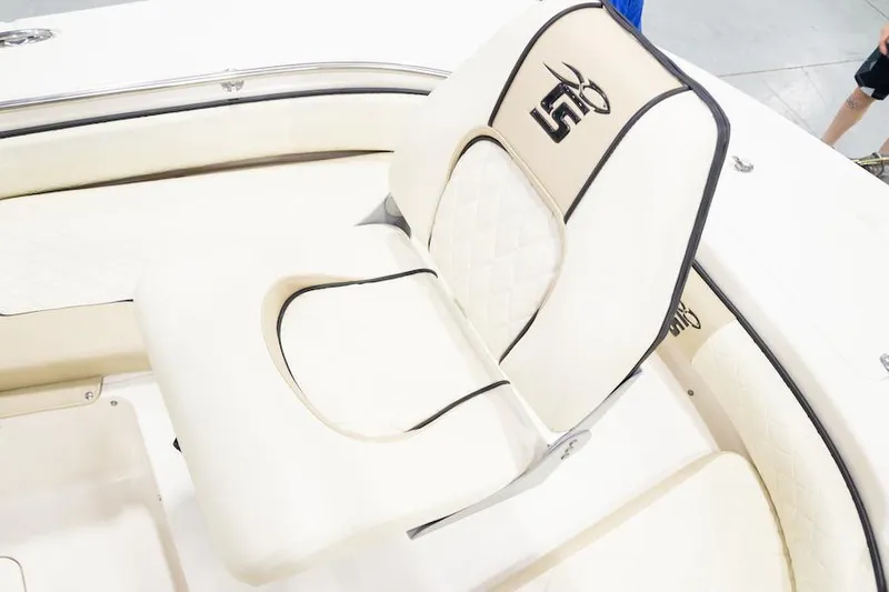 Slide: The Image of Manufacturer Provided Image: 2026 Carolina Skiff 24 Ultra Elite boat seat with white and black trim. - 10