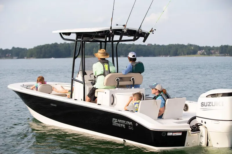 Slide: The Image of Manufacturer Provided Image: 2026 Carolina Skiff 24 Ultra Elite boat on water with passengers enjoying a sunny day. - 5