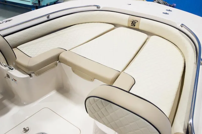 Slide: The Image of Manufacturer Provided Image: 2026 Carolina Skiff 24 Ultra Elite boat seating with beige and white upholstery. - 7