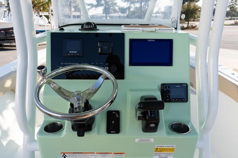 Slide: The Image of Helm of 2026 Sea Pro 225FLXR Sandbar boat with modern controls and displays. - 11
