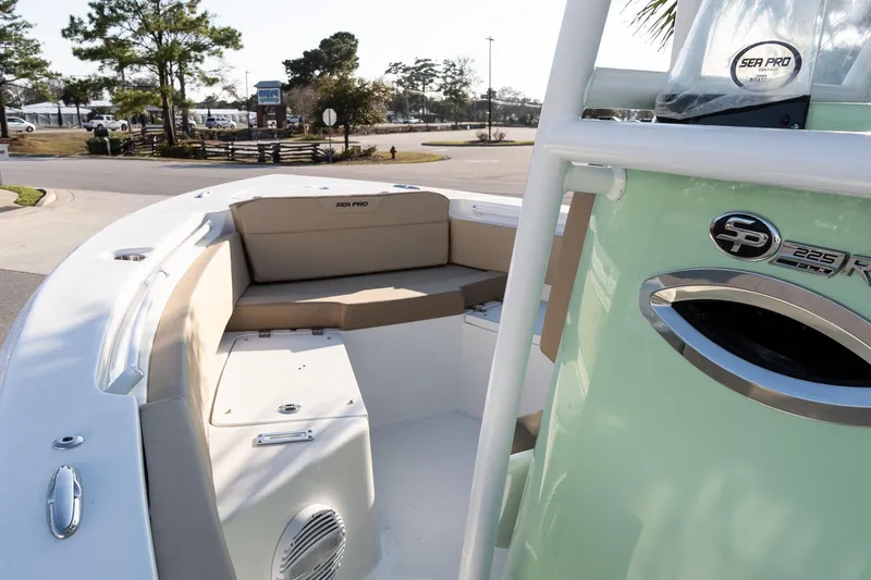 Slide: The Image of 2026 Sea Pro 225FLXR Sandbar boat interior with seating and console details. - 12