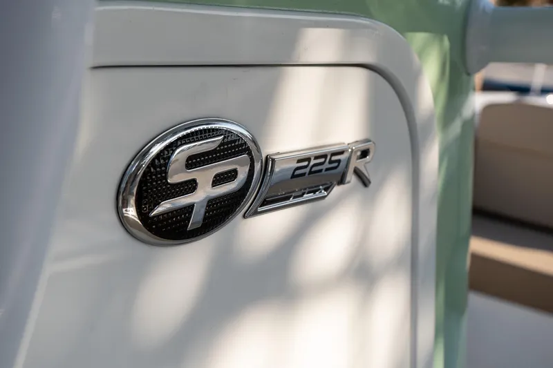 Slide: The Image of Close-up of 2026 Sea Pro 225FLXR Sandbar boat emblem and model badge. - 14