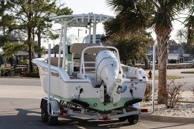 Slide: The Image of 2026 Sea Pro 225FLXR Sandbar boat on trailer, parked near palm trees. - 4