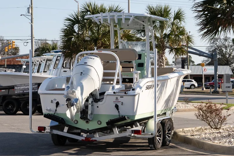 Slide: The Image of 2026 Sea Pro 225FLXR Sandbar boat on trailer, parked outdoors. - 6