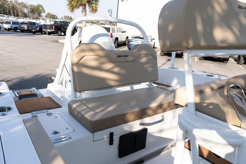 Slide: The Image of 2026 Sea Pro 225FLXR Sandbar boat interior with tan seating and white accents. - 7