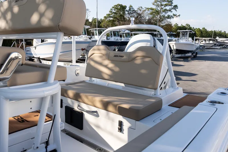 Slide: The Image of 2026 Sea Pro 225FLXR Sandbar boat interior with beige seating and white frame. - 8