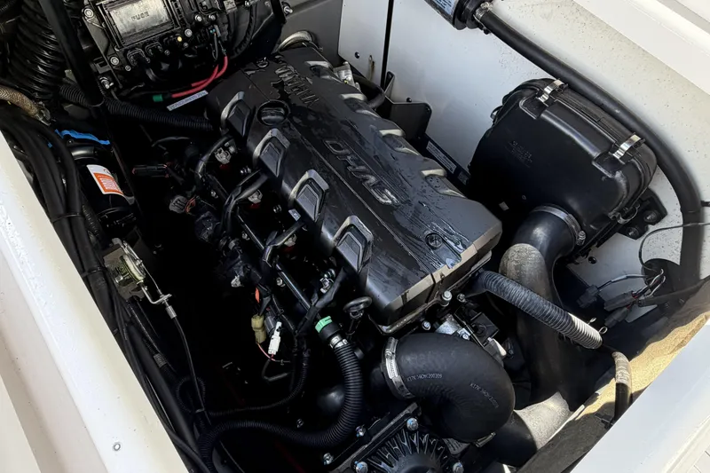 Slide: The Image of Engine compartment of 2021 Yamaha Boats 195 FSH Sport, showcasing detailed components. - 12
