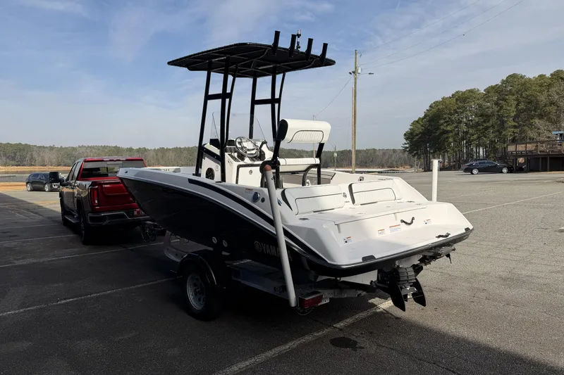 Slide: The Image of 2021 Yamaha Boats 195 FSH Sport on trailer in parking lot, ready for transport. - 5