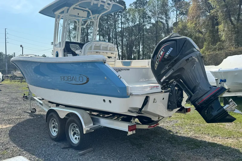Slide: The Image of 2026 Robalo R232 Explorer boat on trailer with Yamaha outboard motor. - 1