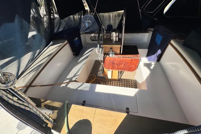 Slide: The Image of 1980 Dickerson Center Cockpit Ketch interior with wooden accents and nautical equipment. - 20