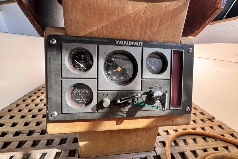 Slide: The Image of Yanmar engine control panel on 1980 Dickerson Center Cockpit Ketch sailboat. - 23