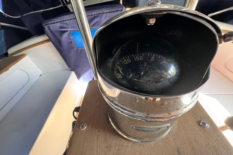 Slide: The Image of Compass on 1980 Dickerson Center Cockpit Ketch, showcasing nautical navigation equipment. - 26