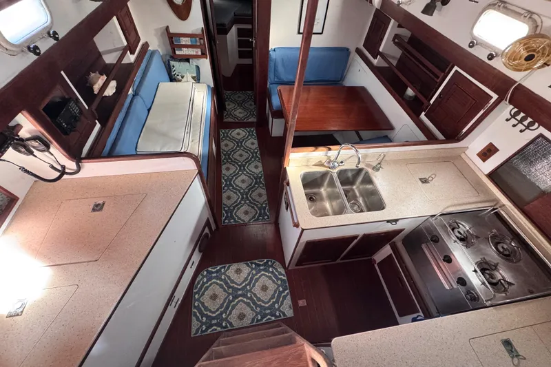 Slide: The Image of Interior of 1980 Dickerson Center Cockpit Ketch with kitchen and seating area. - 32